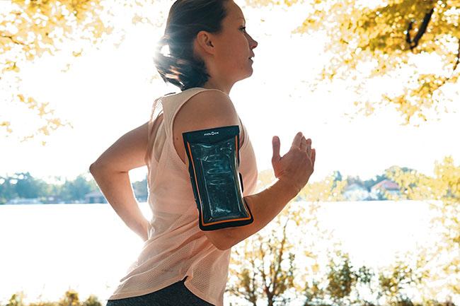 Woman with HERMETIC armband doing sports running