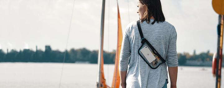 Woman with sail boat and HERMETIC sling bag 